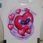 This is a Tattoo design airbrushed on a T-shirt. A Client commissioned me to paint this Tattoo design on a T-shirt for herself.